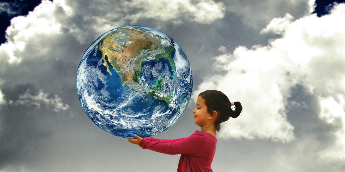 Child holding planet Earth