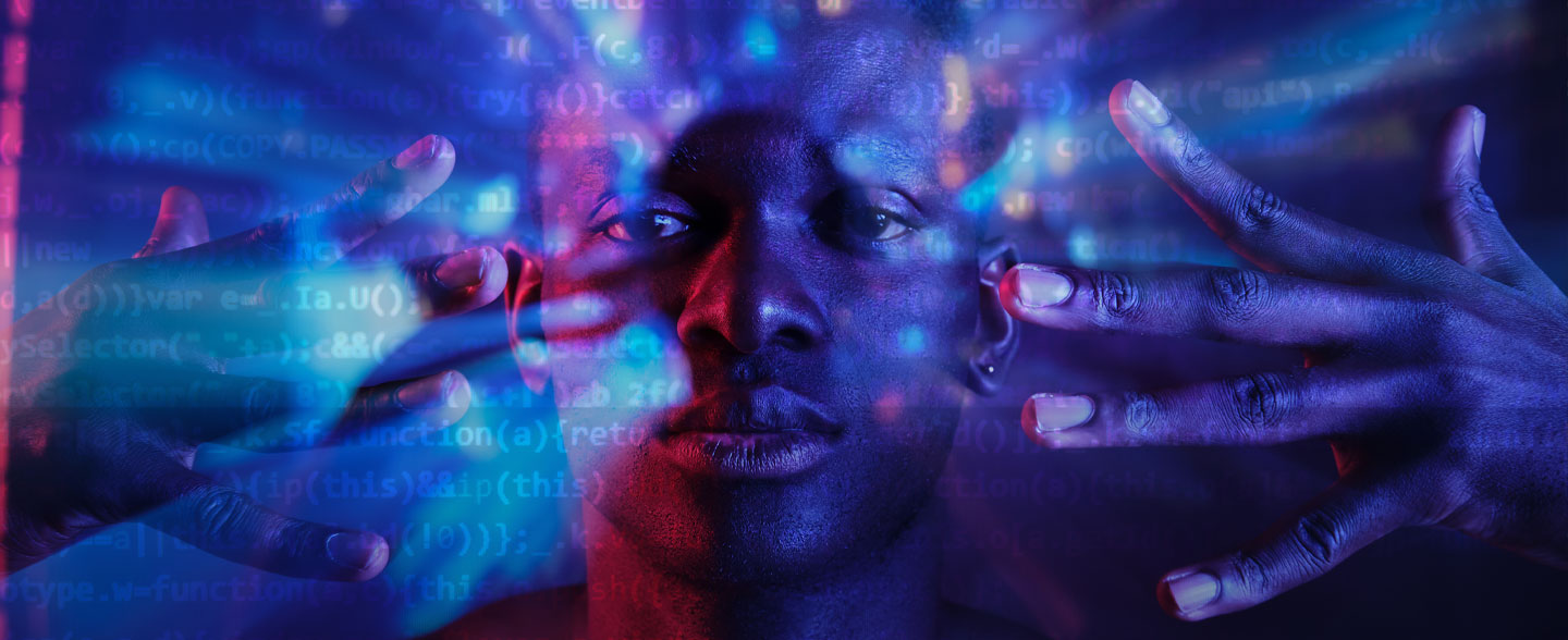 Image of man with hands by face, he codes by hand
